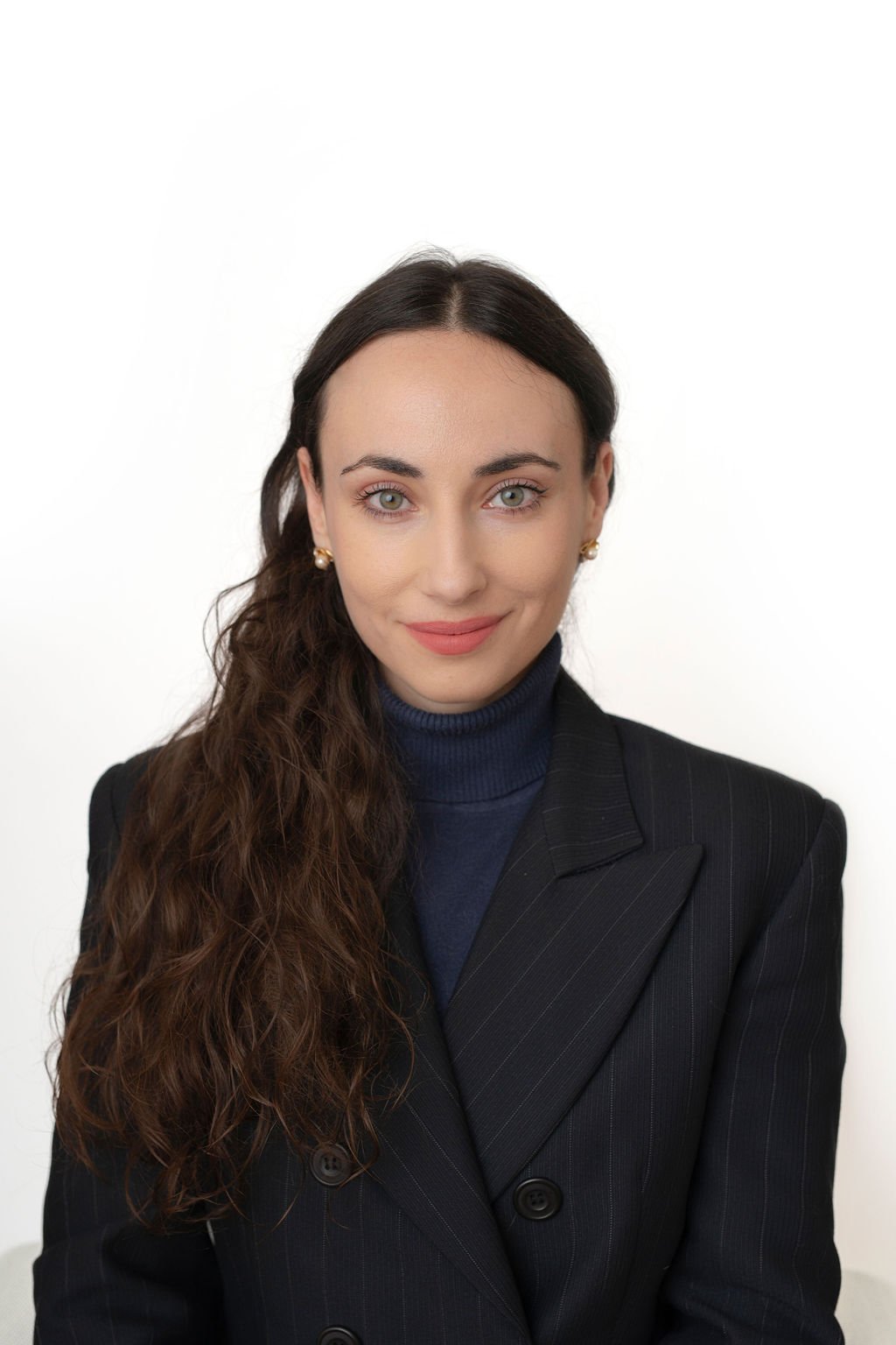 professional headshot of FrontierResolve co-founder & CEO, Dr Valentina Pegolo